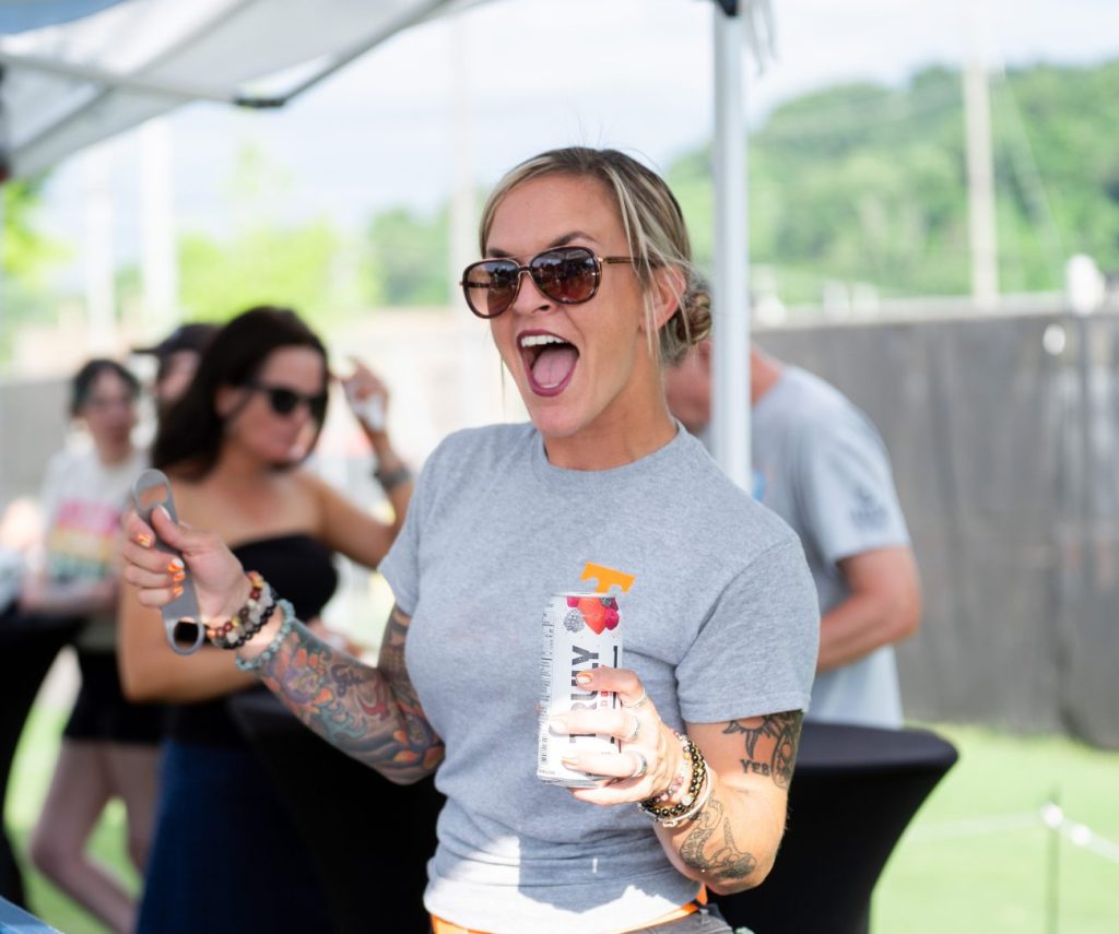 One Knoxville fan enjoys a drink in a premium area