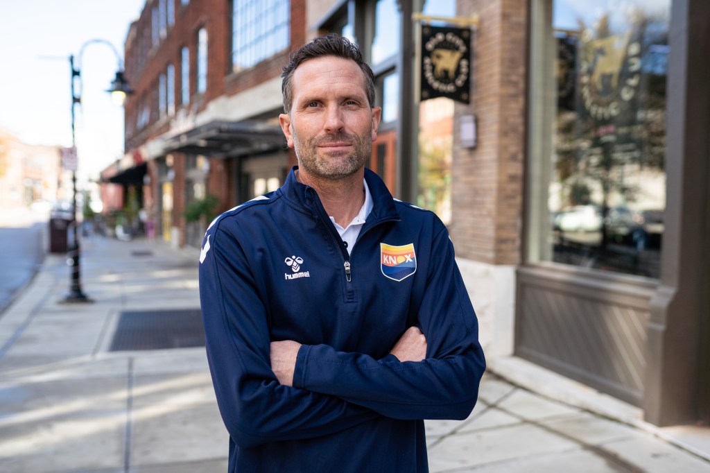 Ian Fuller, new One Knoxville SC Head Coach, standing with arms crossed